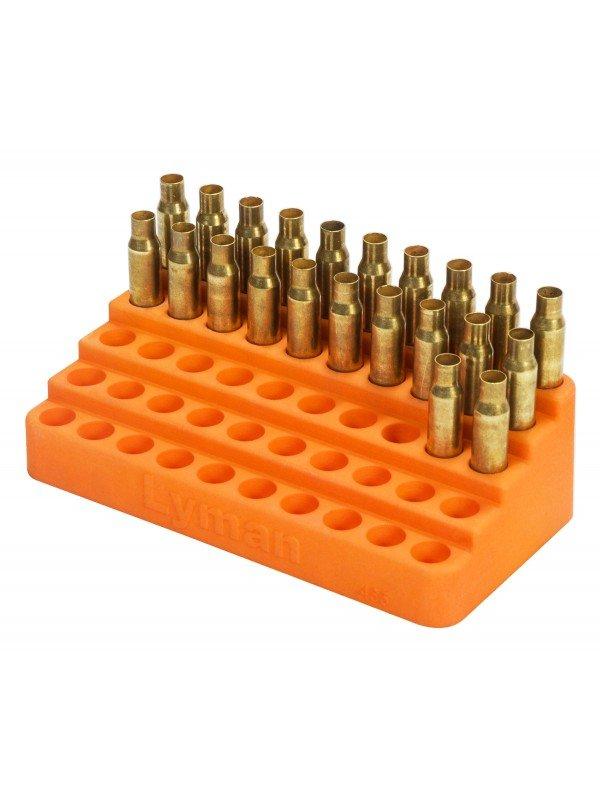Стъпковидна тава с гнезда за подреждане на гилзи . 565 pistol